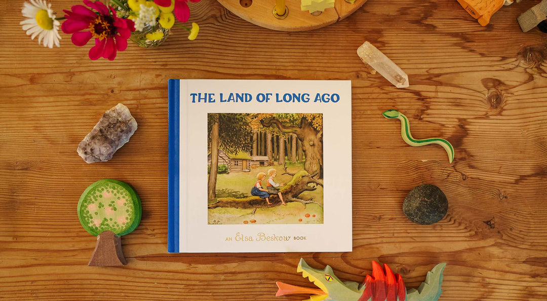 The Land of Long Ago book on a wooden table.
