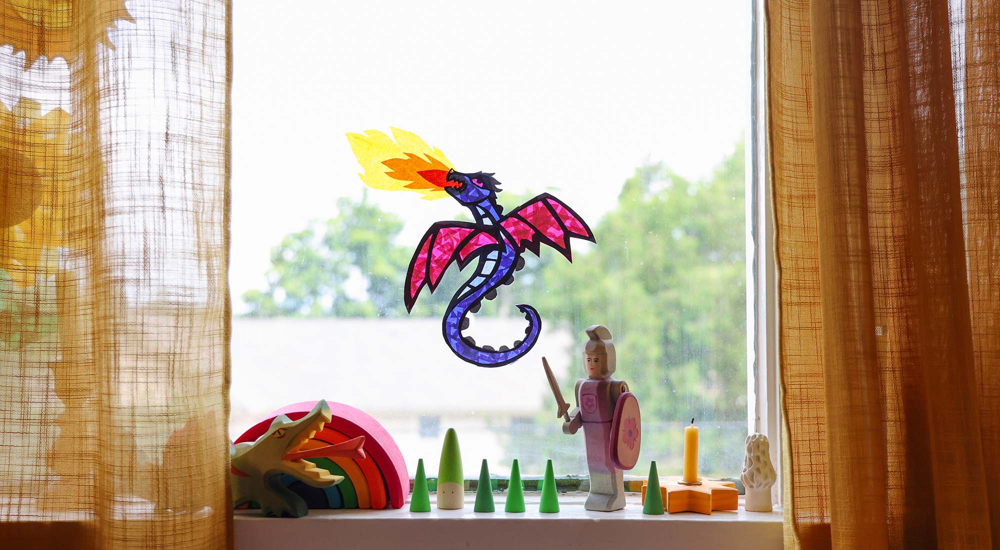A dragon transparency craft on a window.