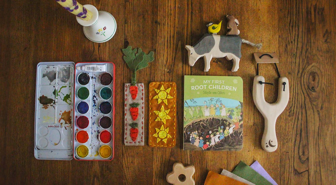 Lay flat image of felt bookmarks on a table with Waldorf toys