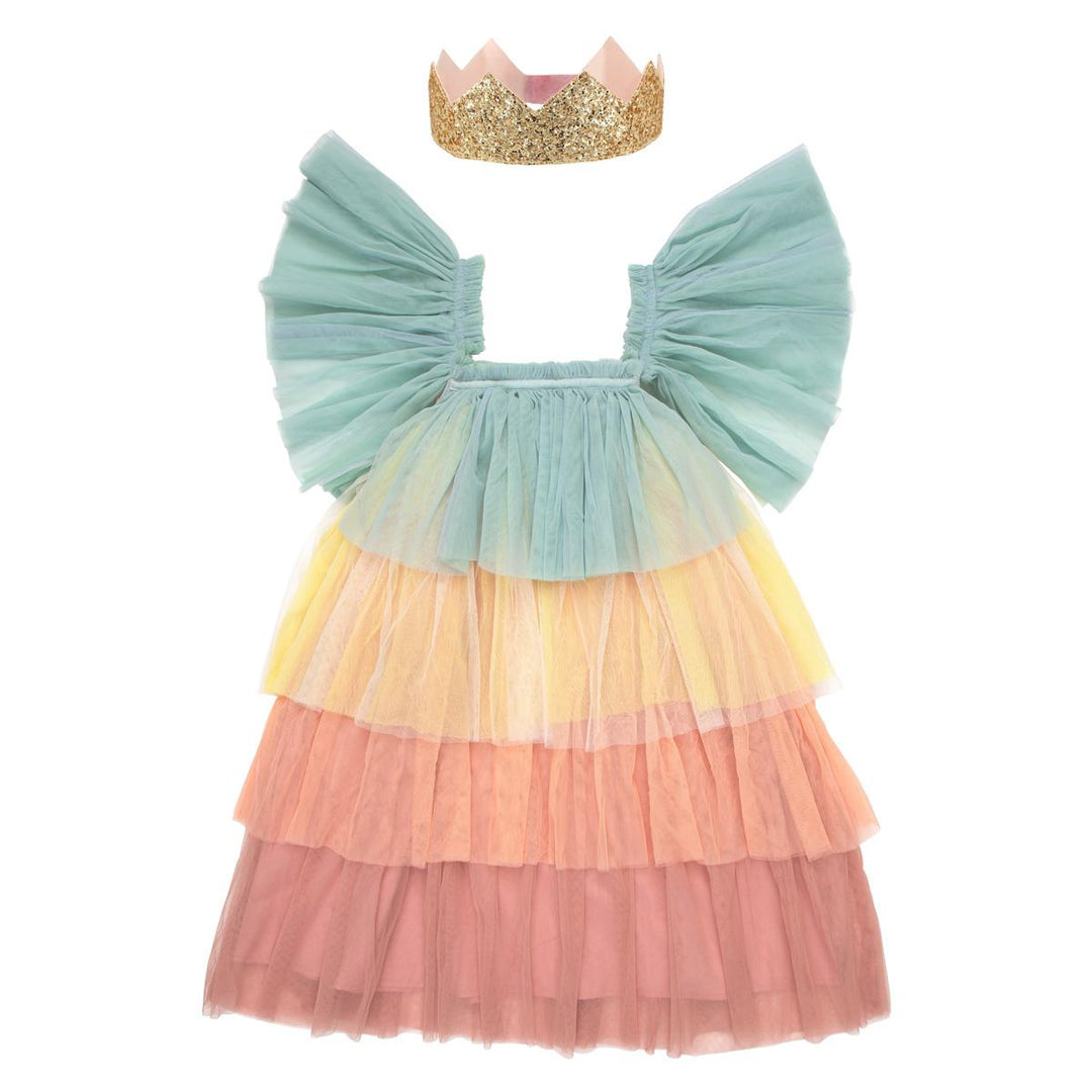 Children’s pastel Rainbow Ruffle Princess Costume Set featuring a rainbow tulle dress with large flutter sleeves and gold glitter crown from Meri Meri against a white background.