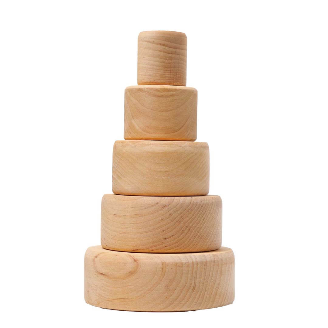 Stack of wooden bowls on a white background.