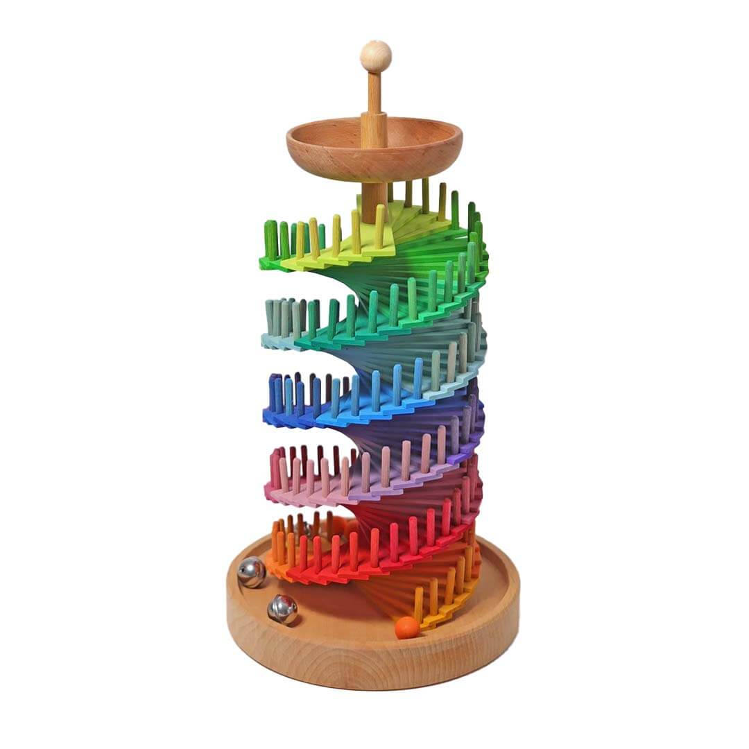 Colorful wooden marble run toy on a white background.
