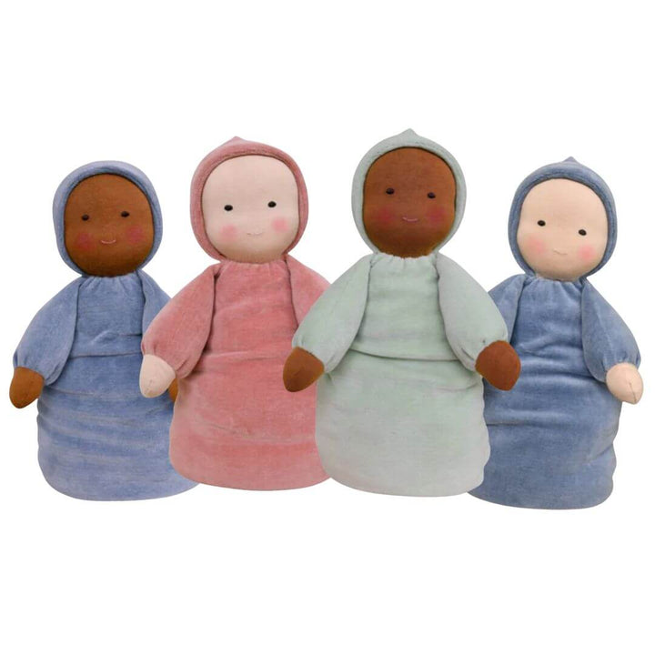 Four soft Waldorf Doll babies in different colored dresses on a white background