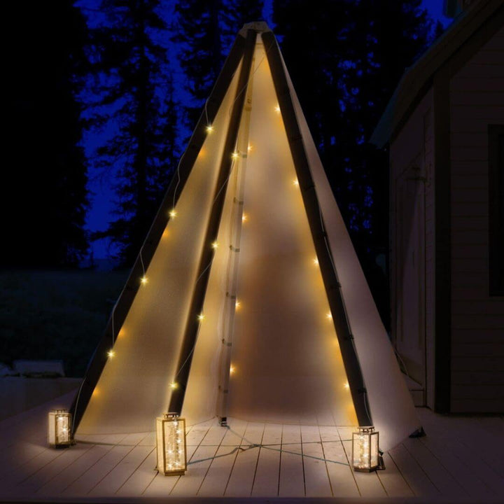 Bijou Build Haven modular tent system outdoors with LED lights at night.