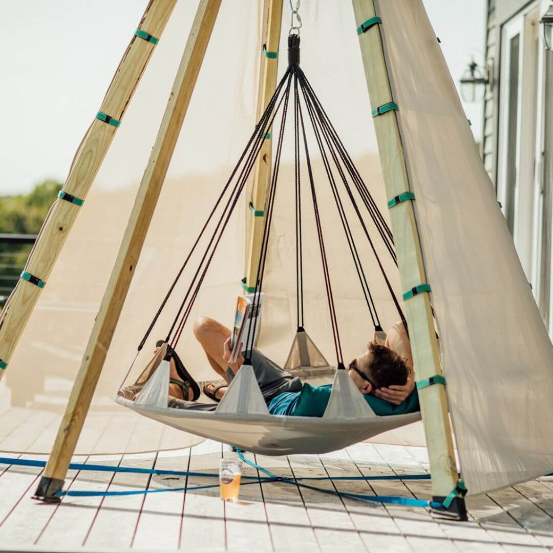 Bijou Build Nest outdoor shelter with suspended 5-foot Hover swing, UV-protective fabric canopy, solar LED lights, and cushions for relaxing outdoors - Bella Luna Toys