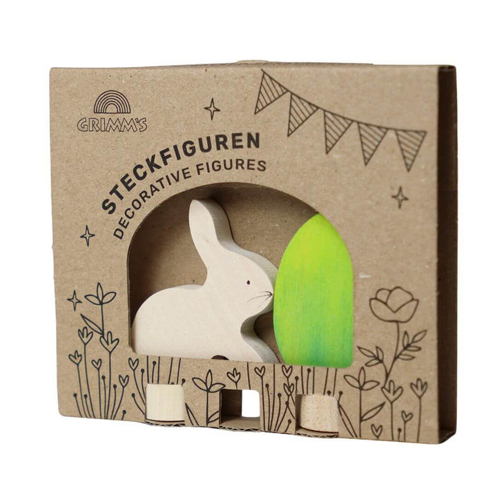 Grimm’s Wooden Easter Egg and Bunny in the green colorway, in the beautifully illustarted cardboard packaging that they arrive in.