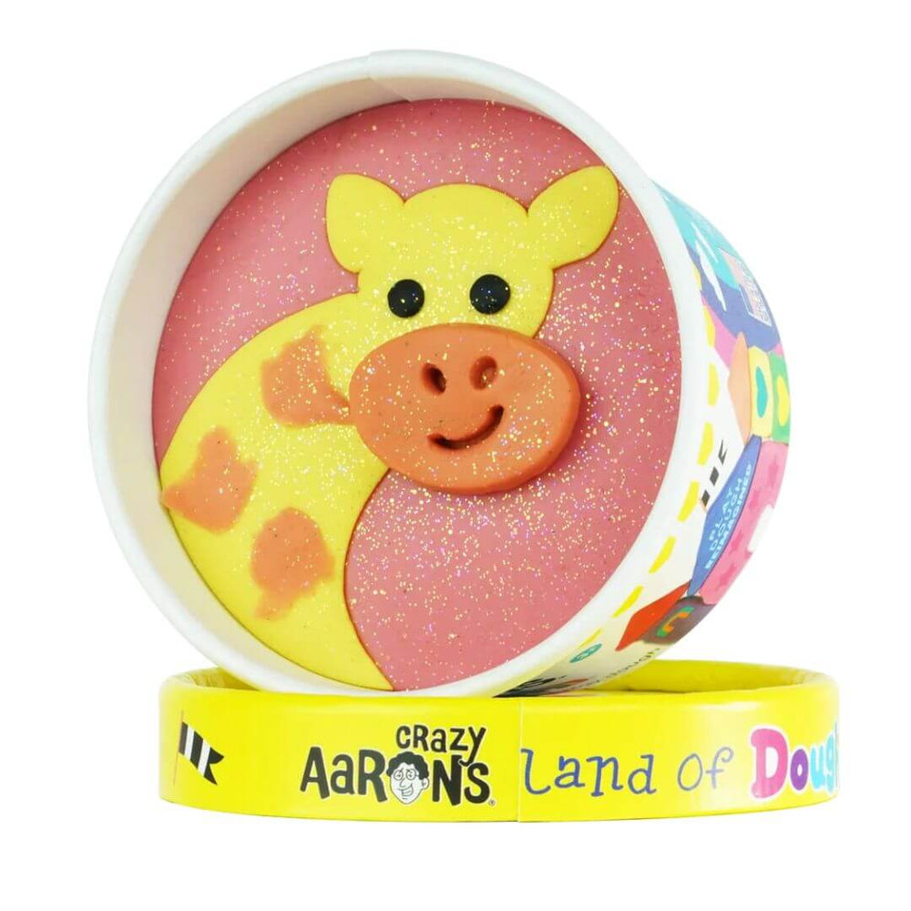 Giraffe-shaped Land of Dough play dough cup with colorful compostable glitter in a round yellow container, featuring eco-friendly, sensory play packaging.