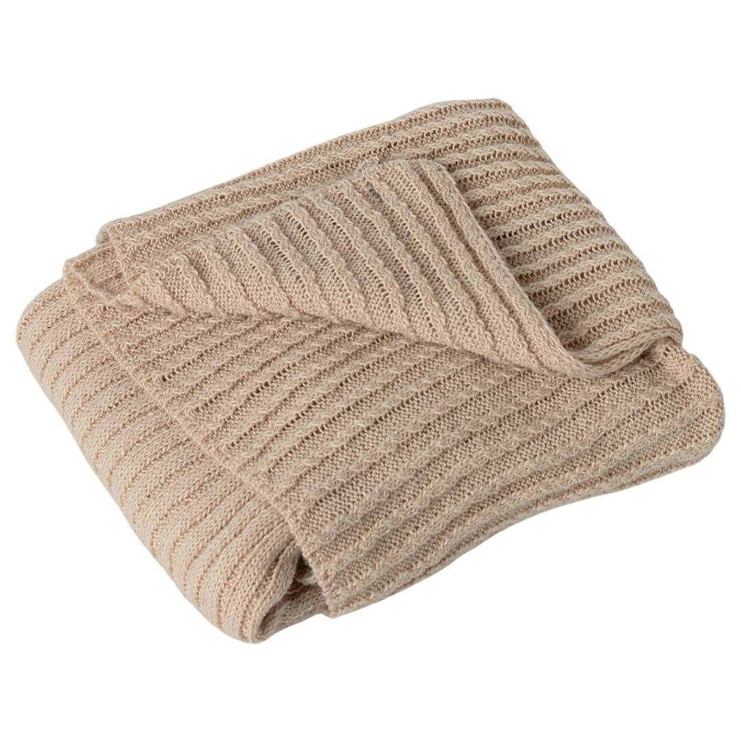 Folded beige Maileg knit ribbed baby blanket with decorative tag and soft, textured pattern with one corner folded back.