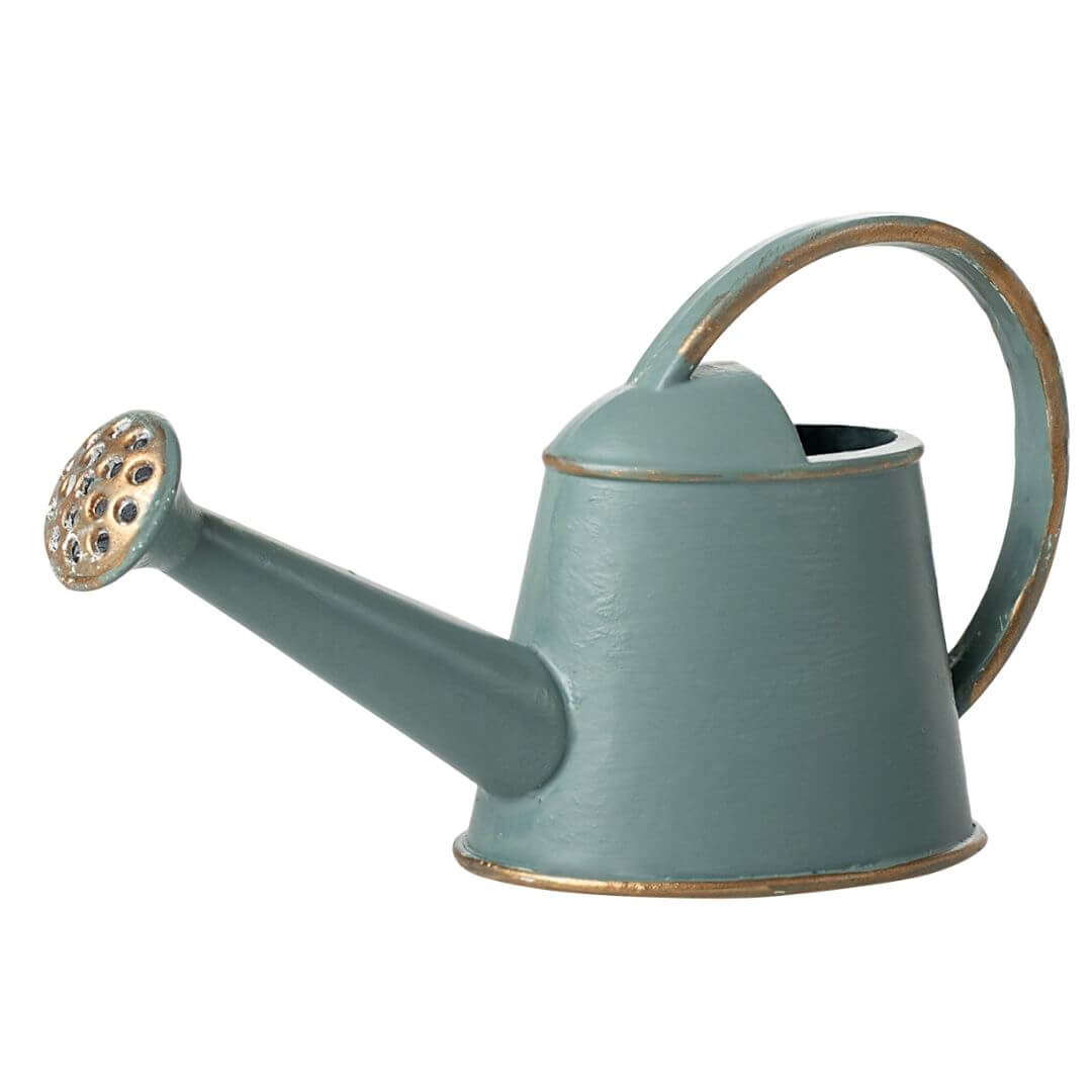 Miniature Maileg watering can in vintage light blue with curved handle and spout, styled for mouse-sized garden play.