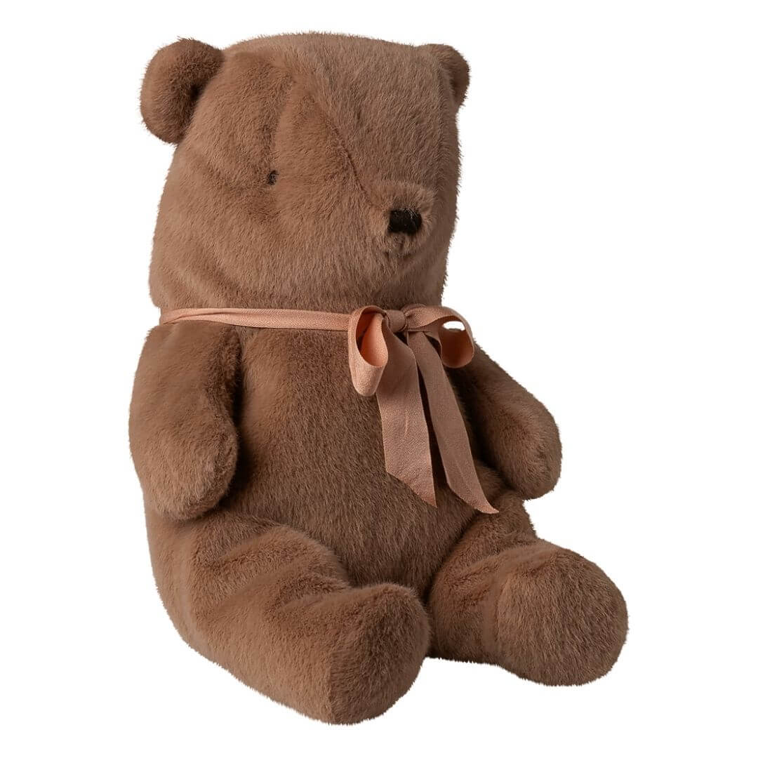 Maileg - Soft brown Maileg teddy bear with plush fur and a peach ribbon bow sitting upright against a white background - Bella Luna Toys