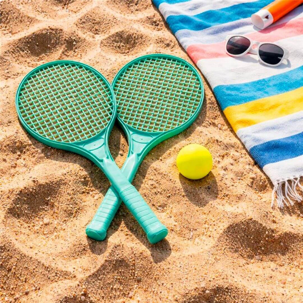 Miniland Eco Racket and Ball Set laying in sand