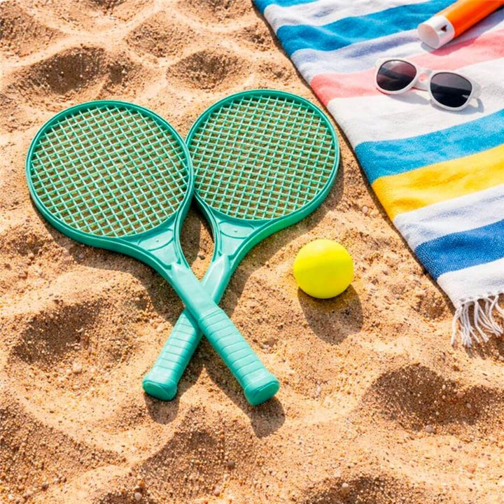 Miniland Eco Racket and Ball Set laying in sand