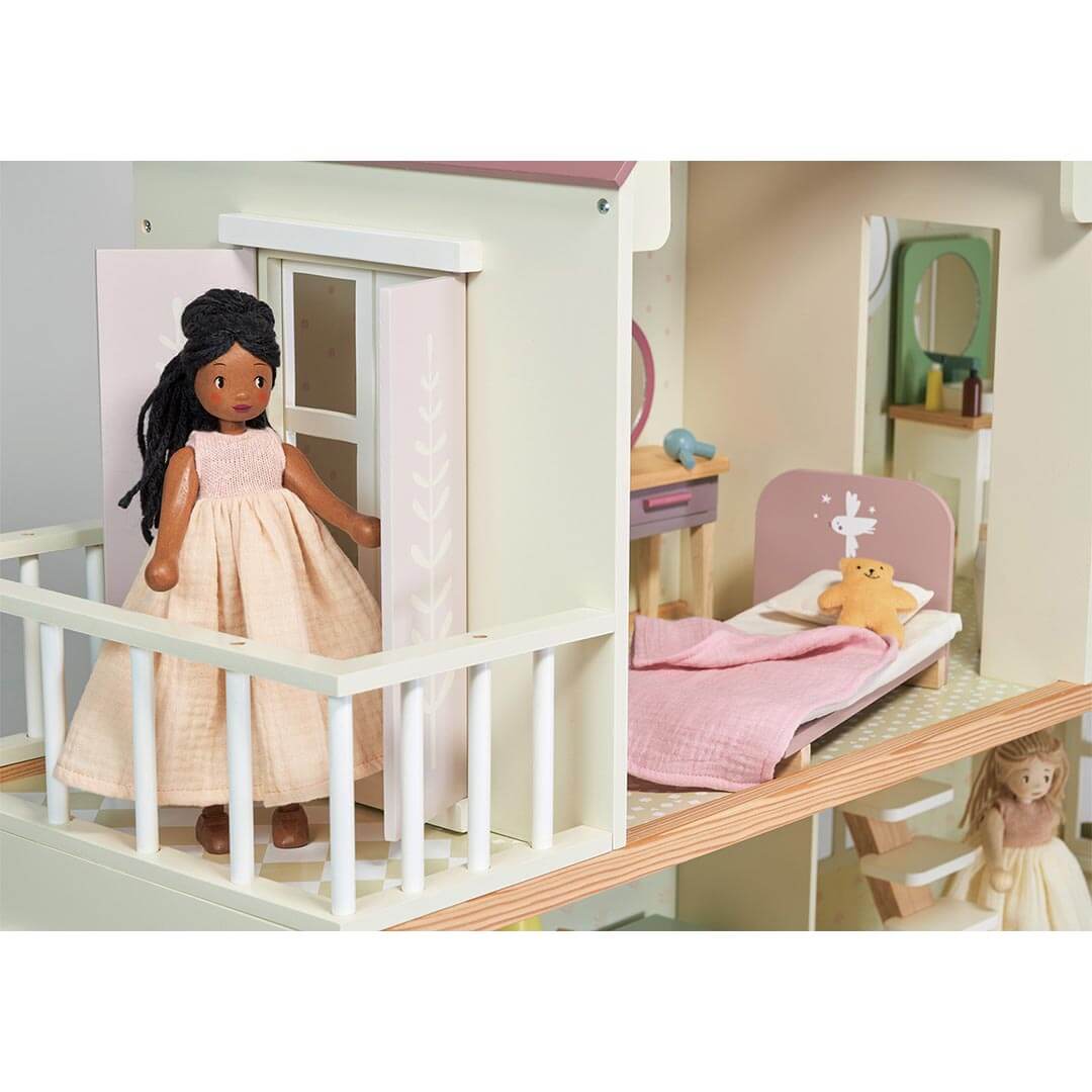 Lola Wooden Doll standing on balcony of Tender Leaf Toys Mulberry Mansion Wooden Dollhouse