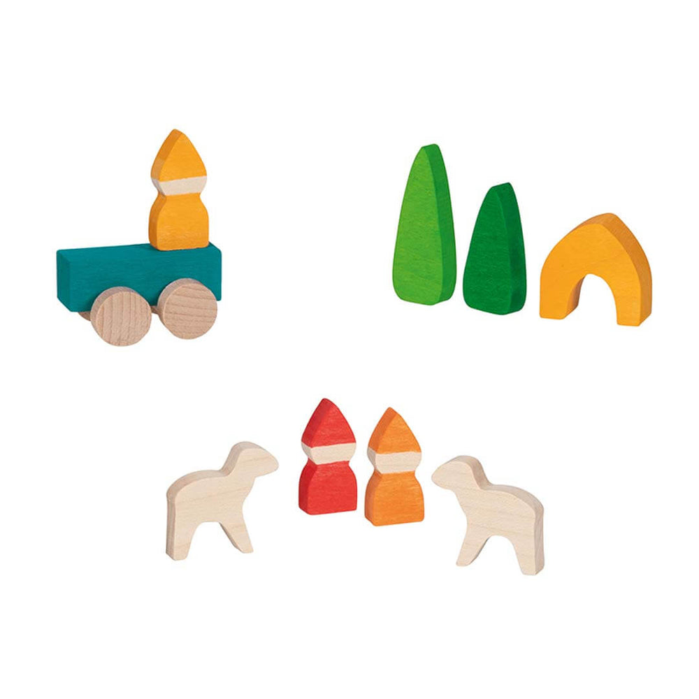A set of colorful wooden toy blocks on a plain white background, including a train, trees, an arch, and animal and house shapes in natural wood and painted colors.