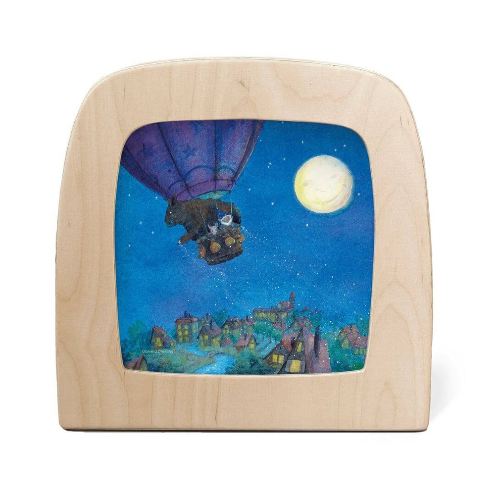 Toverlux StoryLux Magic Lamp Night Light Silhouette – Goodnight Sandman Balloon Scene featuring a whimsical purple hot air balloon drifting over a starlit village with a glowing moon above.