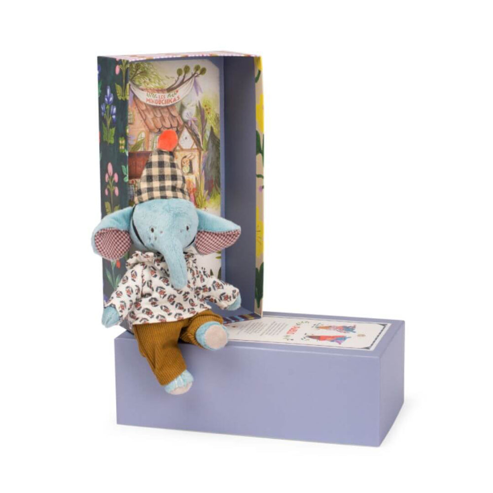 Pablo the elephant wearing a birthday hat and sitting on a decorated box.
