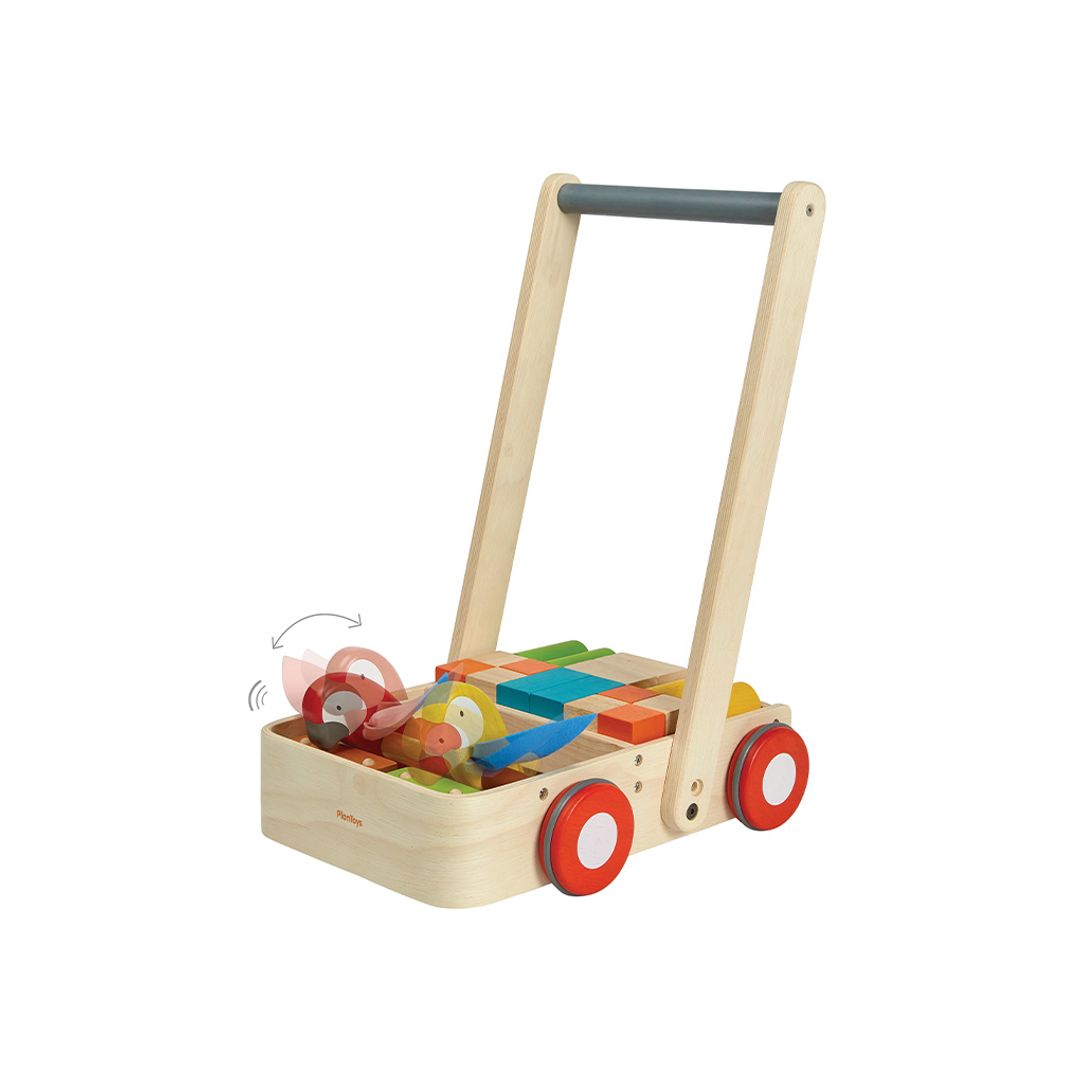 An image that show the birds in motion with arrows directing the way that they move as the PlanToys Wooden Bird Walker Wagon rolls along with early walkers. 