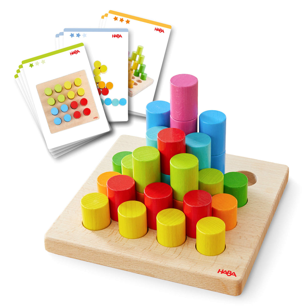 Colorful wooden stacking toy with a square base and cylindrical pegs, accompanied by pattern cards.