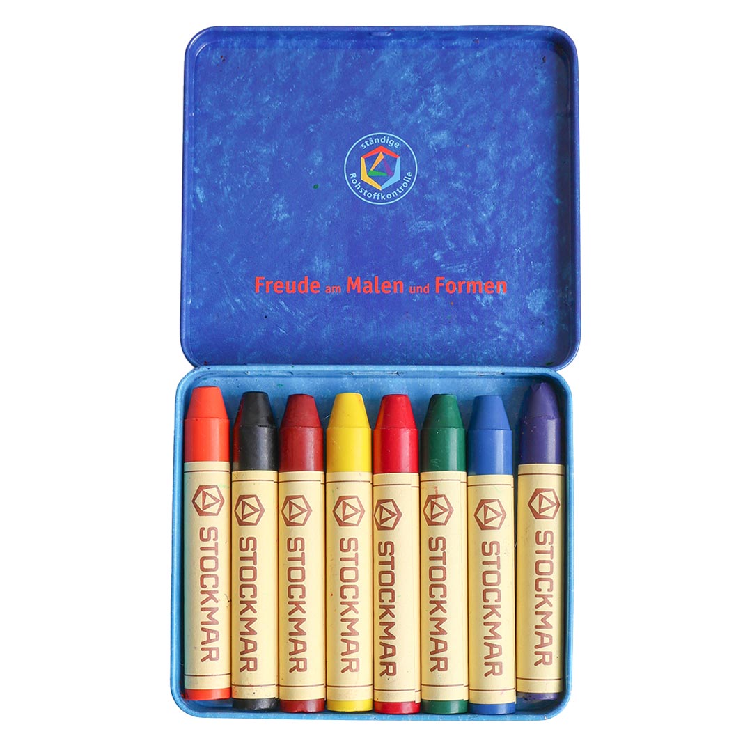 Set of Stockmar crayons in a blue tin with visible branding.