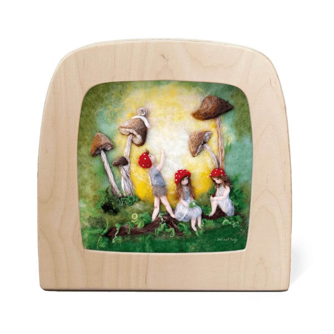Toverlux Magic Lamp Night Light Silhouette showing felted children with red toadstool hats playing among tall mushrooms, lit by a warm golden background.