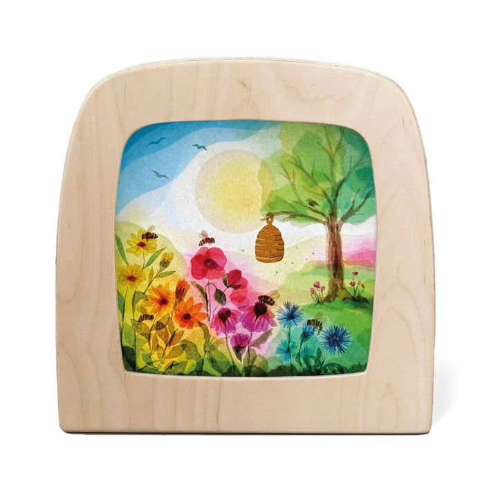 A spring transparency for the Toverlux lamp featuring artwork from the Vogel Geluk Collection.