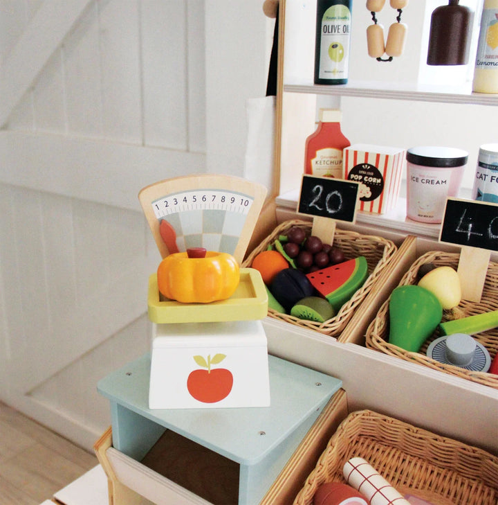 Tender Leaf Toys - Wooden Play Market Scale in a playroom market set up - Bella Luna Toys