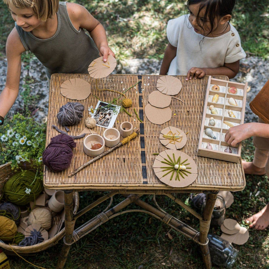 Grapat- Children playing outside, crafting, and one is playing with the Wild creatures in sorting tray- Bella Luna Toys